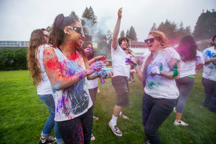 students throwing paint at the Holi Festival