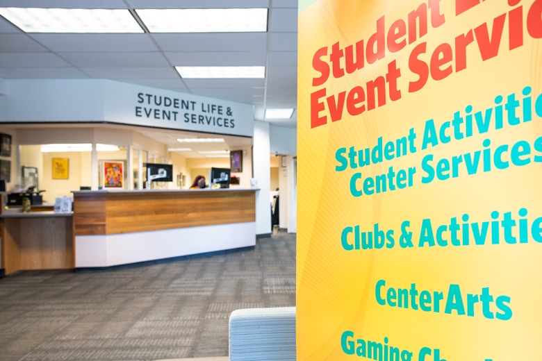 front of the SLES counter with banner sign in the forefront